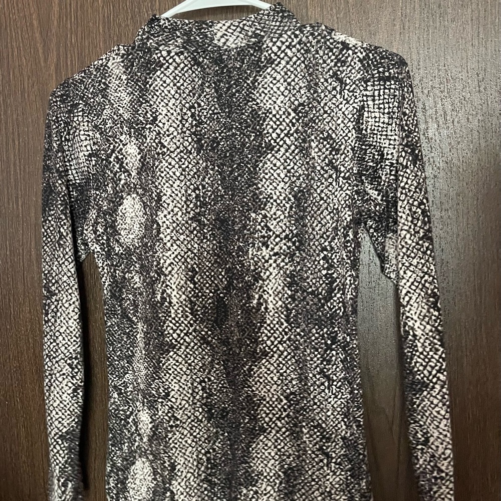 Selling size small, long sleeve, slight turtle neck, snake skin shirt.